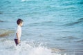 Little boy playing with wave and sand on Pattaya beach Royalty Free Stock Photo