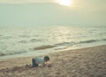 Little boy playing with wave and sand on Pattaya beach Royalty Free Stock Photo