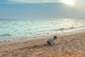 Little boy playing with wave and sand in Pattaya Beach Thailand Royalty Free Stock Photo