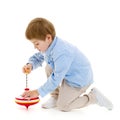 Little boy playing with a whirligig. Royalty Free Stock Photo