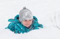 Little boy playing in the white fluffy fresh snow in winter. Royalty Free Stock Photo