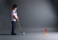 Little boy plays mini golf Royalty Free Stock Photo