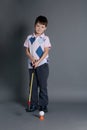 Little boy plays mini golf Royalty Free Stock Photo