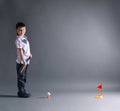 Little boy plays mini golf Royalty Free Stock Photo