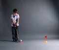 Little boy plays mini golf Royalty Free Stock Photo