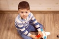 Little boy plays with toy car at home Royalty Free Stock Photo