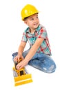 Little boy plays with toy tractor Royalty Free Stock Photo