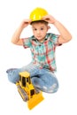 Little boy plays with toy tractor Royalty Free Stock Photo