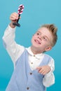 A little boy plays with a toy traffic light. Royalty Free Stock Photo