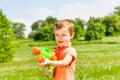 Little boy plays with a water gun Royalty Free Stock Photo