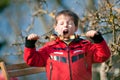 Little boy with pleasure eats grilled vegetables Royalty Free Stock Photo