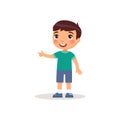 Little boy pointing with index finger flat vector illustration. Smiling male child standing cartoon character. Royalty Free Stock Photo