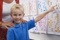 Little Boy Pointing To A Calendar Date For Teacher