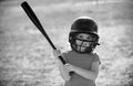 Little boy posing with a baseball bat. Portrait of kid playing baseball. Royalty Free Stock Photo