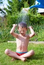 Little boy pouring water from watering can Royalty Free Stock Photo