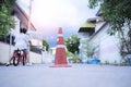 The little boy is practicing cycling a bicycle with the training wheels on the road Royalty Free Stock Photo