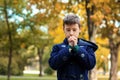 Little boy praying in park Royalty Free Stock Photo
