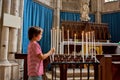 Little boy prays and puts a candle in Orthodox Church Royalty Free Stock Photo