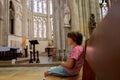 Little boy prays and puts a candle in Orthodox Church Royalty Free Stock Photo