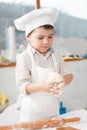 Little boy preparing dough