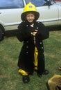 Little boy pretending to be a fireman in Brighton, England