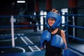 Little boy in protective wear and with nose bleed training in the boxing ring Royalty Free Stock Photo