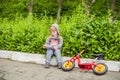 Little boy reading a book under big linden tree Royalty Free Stock Photo