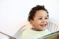 Little boy reading a newspaper stock photo