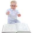 Little boy reads a big book Royalty Free Stock Photo