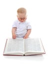 Little boy reads a big book Royalty Free Stock Photo