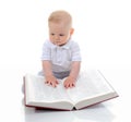 Little boy reads a big book