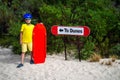 Little boy is ready for sandboarding from  sand dunes Royalty Free Stock Photo