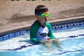 Little boy ready to swim in pool Royalty Free Stock Photo