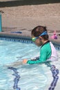 Little boy ready to swim in pool Royalty Free Stock Photo