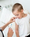 Little boy receiving injection or vaccine Royalty Free Stock Photo