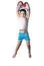 Little boy with red boxing gloves victory jump on white background isolated