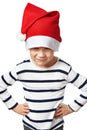 Little boy in red Santa hat is funny and angry isolated