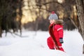 Little boy in red winter clothes having fun with fresh snow Royalty Free Stock Photo