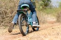 Little boy ride bicycle on the rock road. Royalty Free Stock Photo