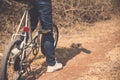 Little boy ride bicycle on the rock road. Royalty Free Stock Photo