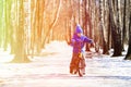 Little boy riding bike in winter, kids sport Royalty Free Stock Photo