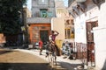 Little boy riding his donkey in the street of jodhpur