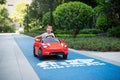Little boy is riding in a remote controlled car Royalty Free Stock Photo