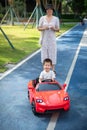 Little boy is riding in a remote controlled car Royalty Free Stock Photo