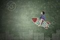 Little boy riding a rocket in chalkboard Royalty Free Stock Photo