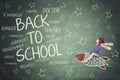 Little boy riding a rocket with text of back to school Royalty Free Stock Photo