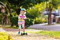 Little boy riding scooter. Kids ride kick board Royalty Free Stock Photo