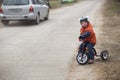 The little boy is riding a tricycle Royalty Free Stock Photo