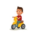 Little boy riding tricycle. Royalty Free Stock Photo