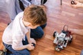 Little boy in robotics school makes robot Royalty Free Stock Photo